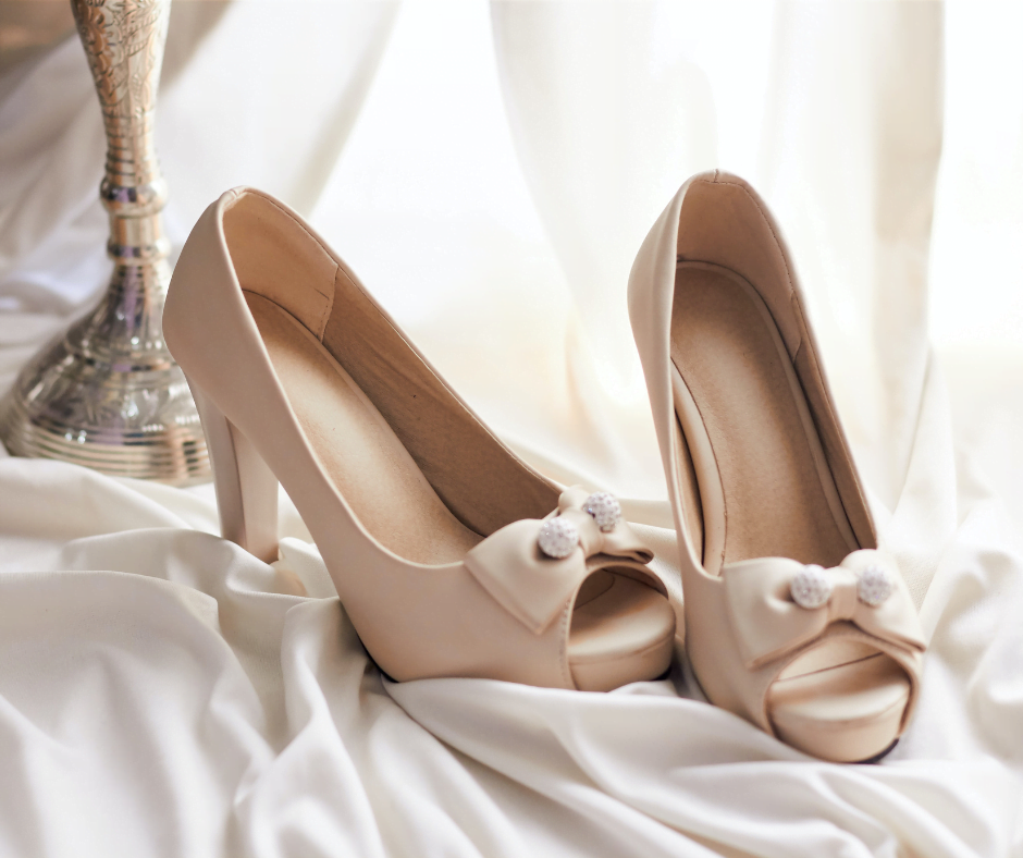 peep toe heel sandals kept on a white colour silk cloth